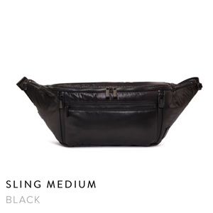 Caraa Sport medium sling bag. NWOT.